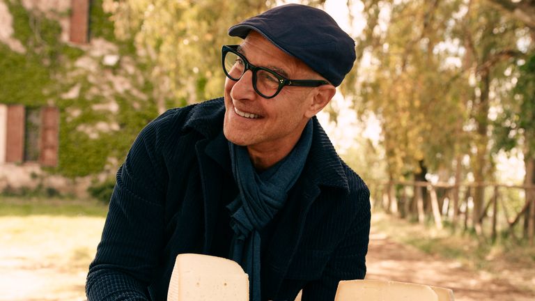 Stanley Tucci holding a cheese made in Lazio. Pic: National Geographic/Matt Holyoak