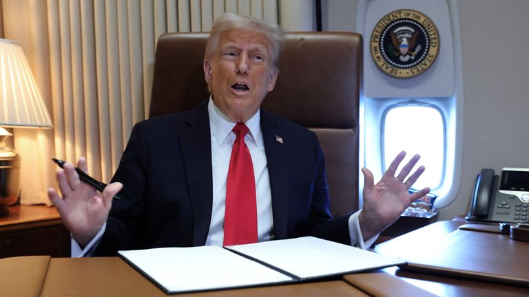 U.S. President Donald Trump speaks to reporters before signing a proclamation renaming the Gulf of Mexico to the Gulf of America, while flying over the gulf aboard Air Force One en route to New Orleans to attend the Super Bowl, February 9, 2025. REUTERS/Kevin Lamarque