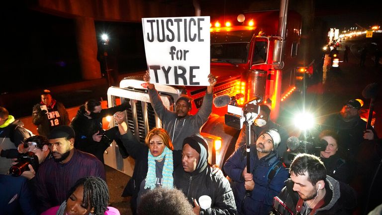Protesters march down the street Friday, Jan. 27, 2023, in Memphis, Tenn., as authorities release police video depicting five Memphis officers beating Tyre Nichols, whose death resulted in murder charges and provoked outrage at the country's latest instance of police brutality. (AP Photo/Gerald Herbert)