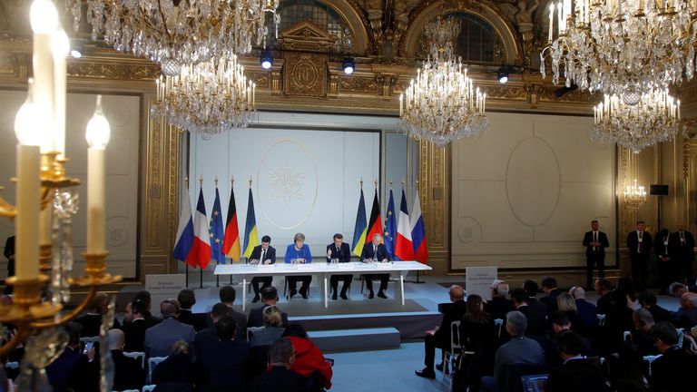 Ukraine's President Volodymyr Zelenskiy, German Chancellor Angela Merkel, French President Emmanuel Macron and Russia's President Vladimir Putin attend a joint news conference after a Normandy-format summit in Paris, France December 9, 2019. REUTERS/Charles Platiau/Pool