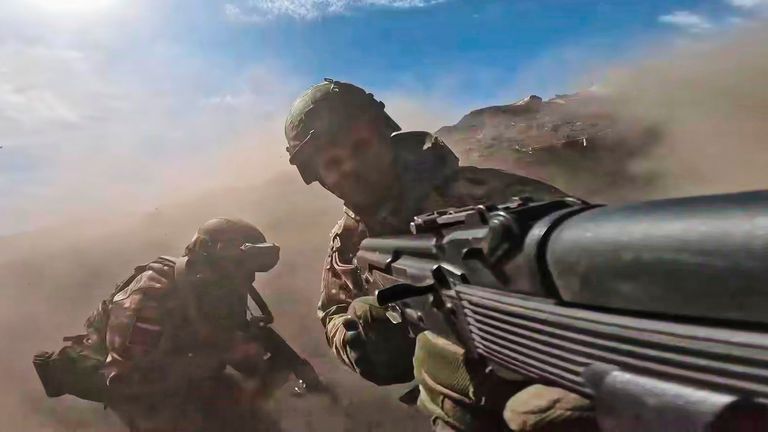 In this photo taken from video distributed by Russian Defense Ministry Press Service on Monday, May 12, 2025, Russian servicemen attend a combat training for assault units in an undisclosed location in Ukraine. (Russian Defense Ministry Press Service via AP)