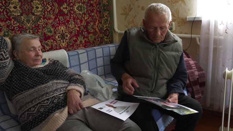 Mr Khilyuk's mother and father, Halyna and Vasyl, show photo of their son
